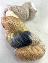 Artyarns Ensemble Light cashmere yarn in F Series colors, showcasing soft, multi-hued skeins of various thicknesses.