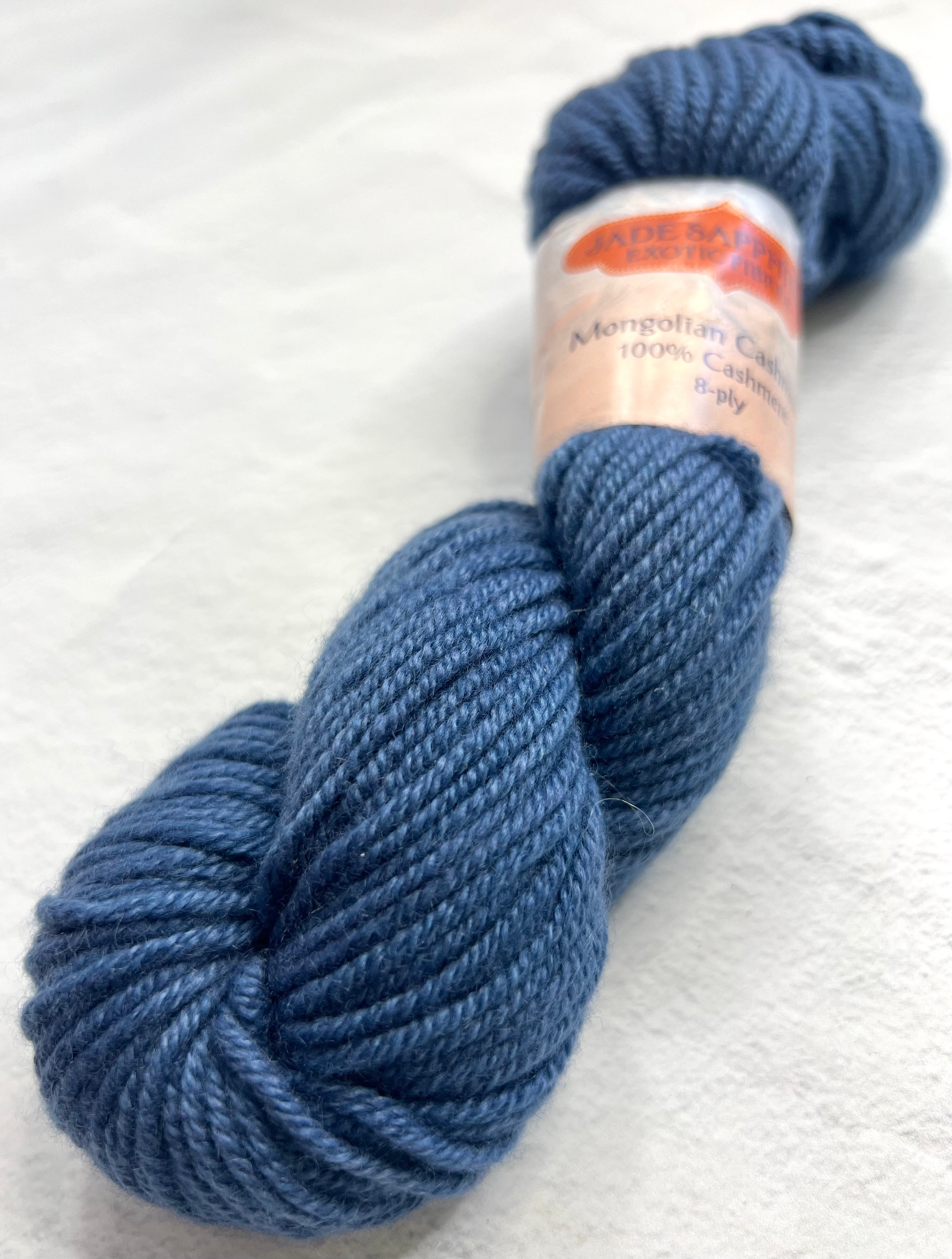 Blue and purple skein of Jade Sapphire 8 Ply Cashmere Yarn by Jade Sapphire Cashmere, showcasing soft, luxurious cashmere fibers.
