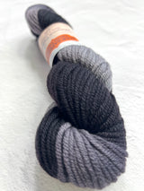 Black Jade Sapphire 8 Ply Cashmere Yarn shown in a skein, highlighting its soft texture and luxurious quality.