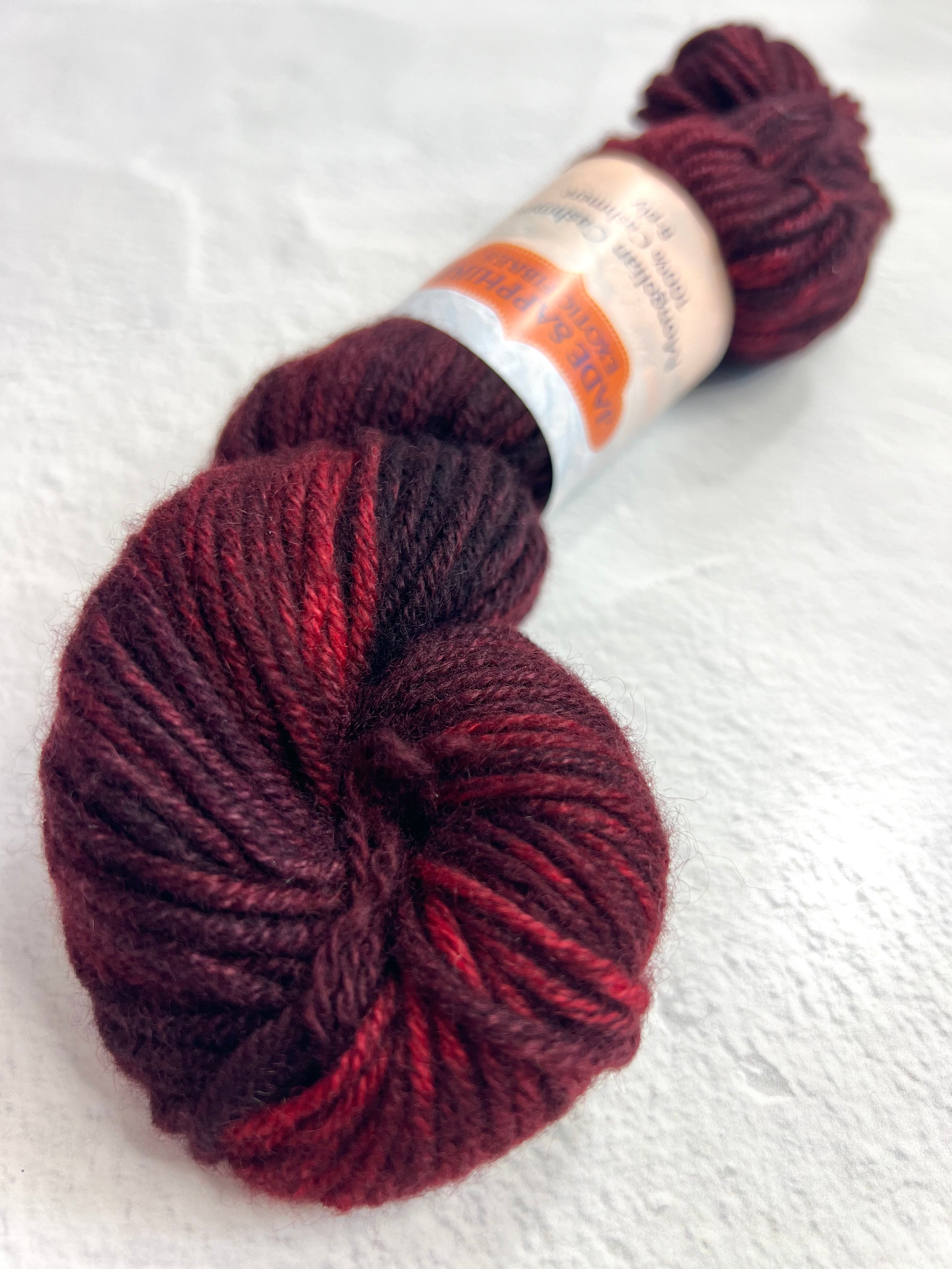 Red Jade Sapphire 8 Ply Cashmere yarn ball from Jade Sapphire Cashmere, showcasing soft, luxurious bright red cashmere fibers.