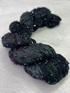 Beaded silk and sequins yarn from Artyarns' Beaded Silk & Sequins Light (H Series) with shiny embellishments and delicate beading.