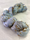 Beaded silk and sequin yarn from Artyarns' Beaded Silk & Sequins Light (H Series) showcasing shimmering beads and luxurious texture.