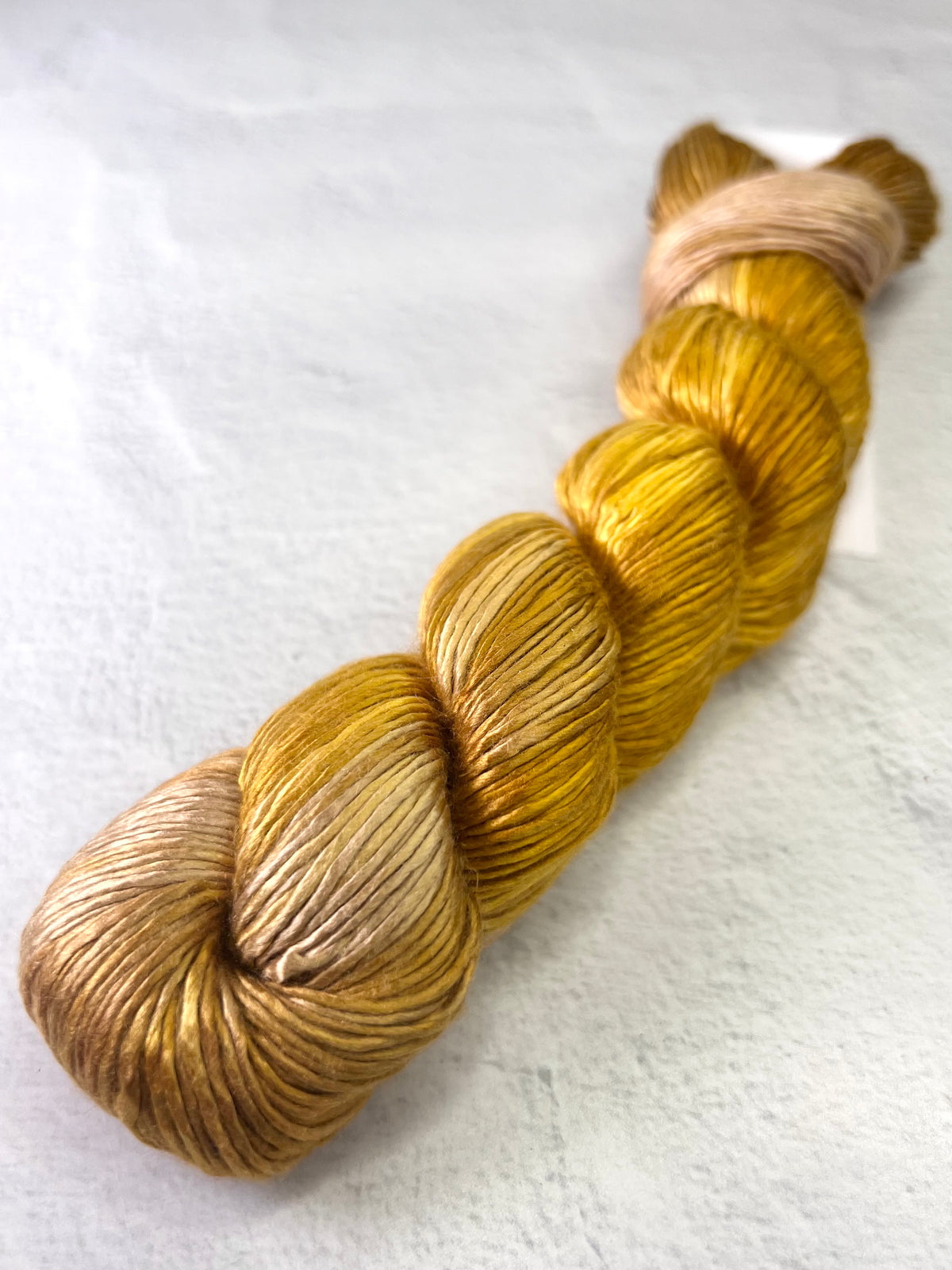 Close-up of Artyarns Regal Silk Yarn H Series, showcasing the rich, glossy silk fibers and vibrant color highlights.
