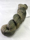 Close-up of Artyarns Regal Silk Yarn H Series with vibrant silk fibers and rich, glossy texture in a natural skein.