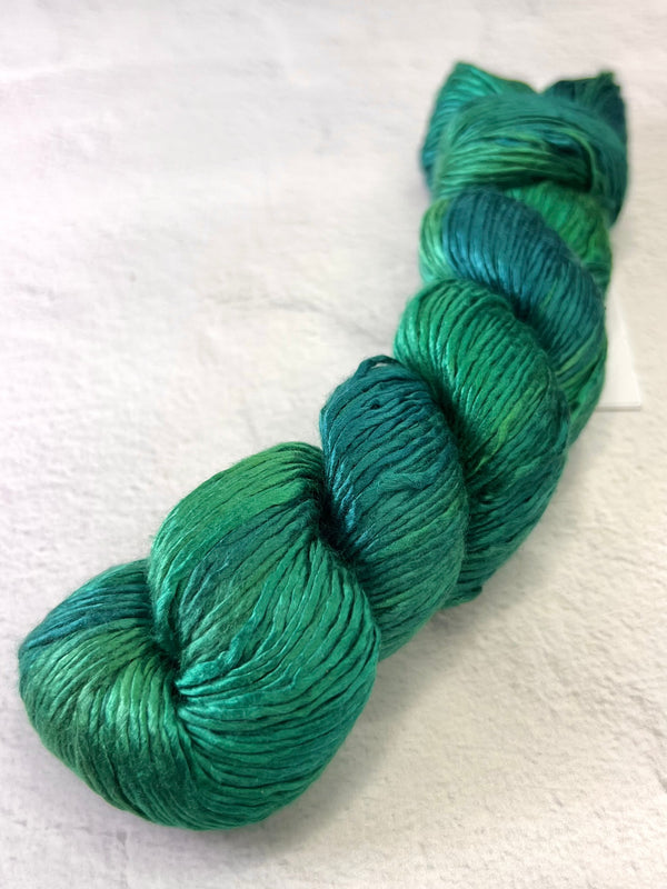 Artyarns Regal Silk Yarn H Series with vibrant silk strands, showcasing luxurious, colorful knitting or crochet material.