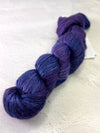 Close-up of Artyarns Regal Silk Yarn H Series with vibrant, shiny silk fibers showcasing rich color highlights.