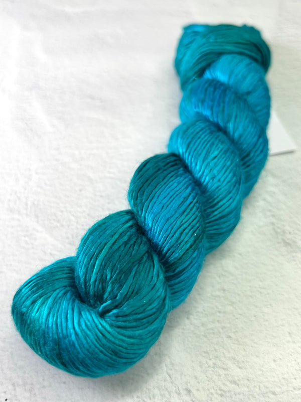 Artyarns Regal Silk Yarn H Series, close-up of luxurious silk yarn with vibrant highlights and soft texture.