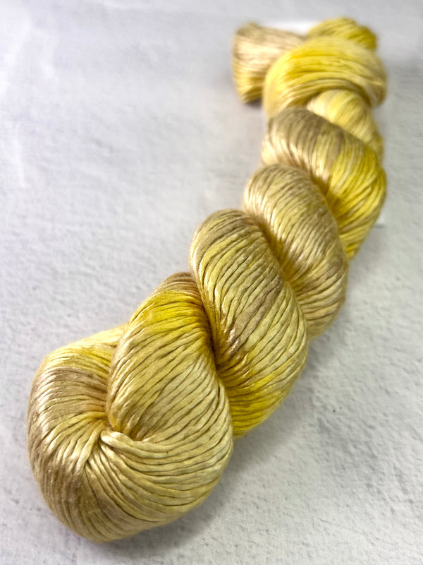 Close-up of Artyarns Regal Silk Yarn H Series in vibrant silk yarn with rich highlights and smooth texture.