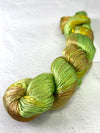 Close-up of Artyarns Regal Silk Yarn H Series with vibrant silk fibers in rich hues, showcasing its luxurious texture.