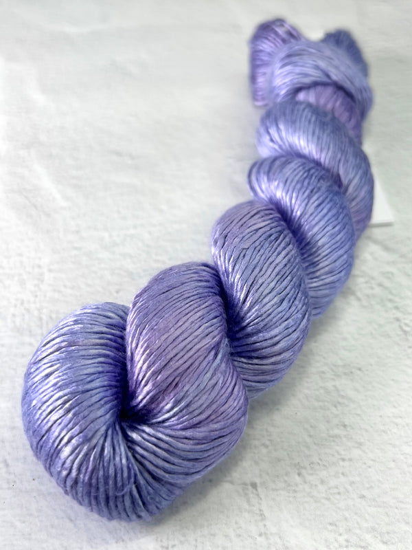 Close-up of Artyarns Regal Silk Yarn H Series in vibrant highlights, showcasing the smooth, glossy silk texture and rich color details.