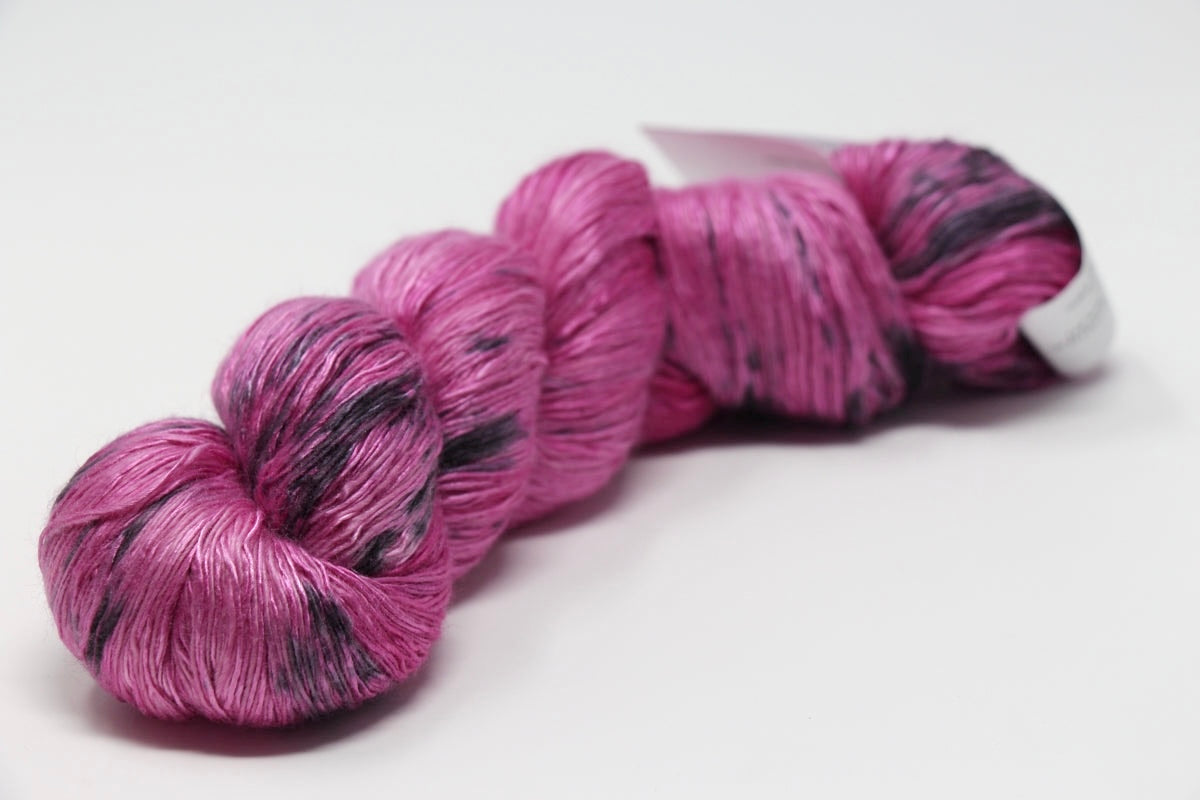 Colorful skein of Artyarns Ensemble Light yarn from the Cosmic Colors series, showcasing vibrant, multi-hued fiber for knitting or crochet.