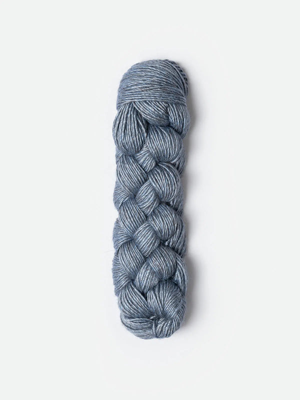 Blue Sky Fibers Metalico alpaca yarn in a soft blue color, showing the smooth, shiny texture of the fiber.