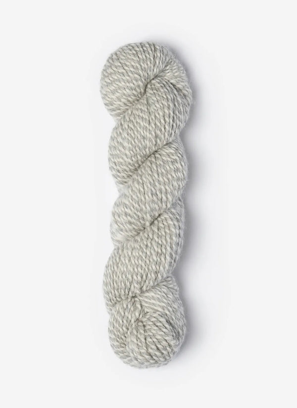 Blue Sky Fibers Baby Alpaca Sport Weight Melange yarn, soft and textured alpaca wool in blue and gray tones.