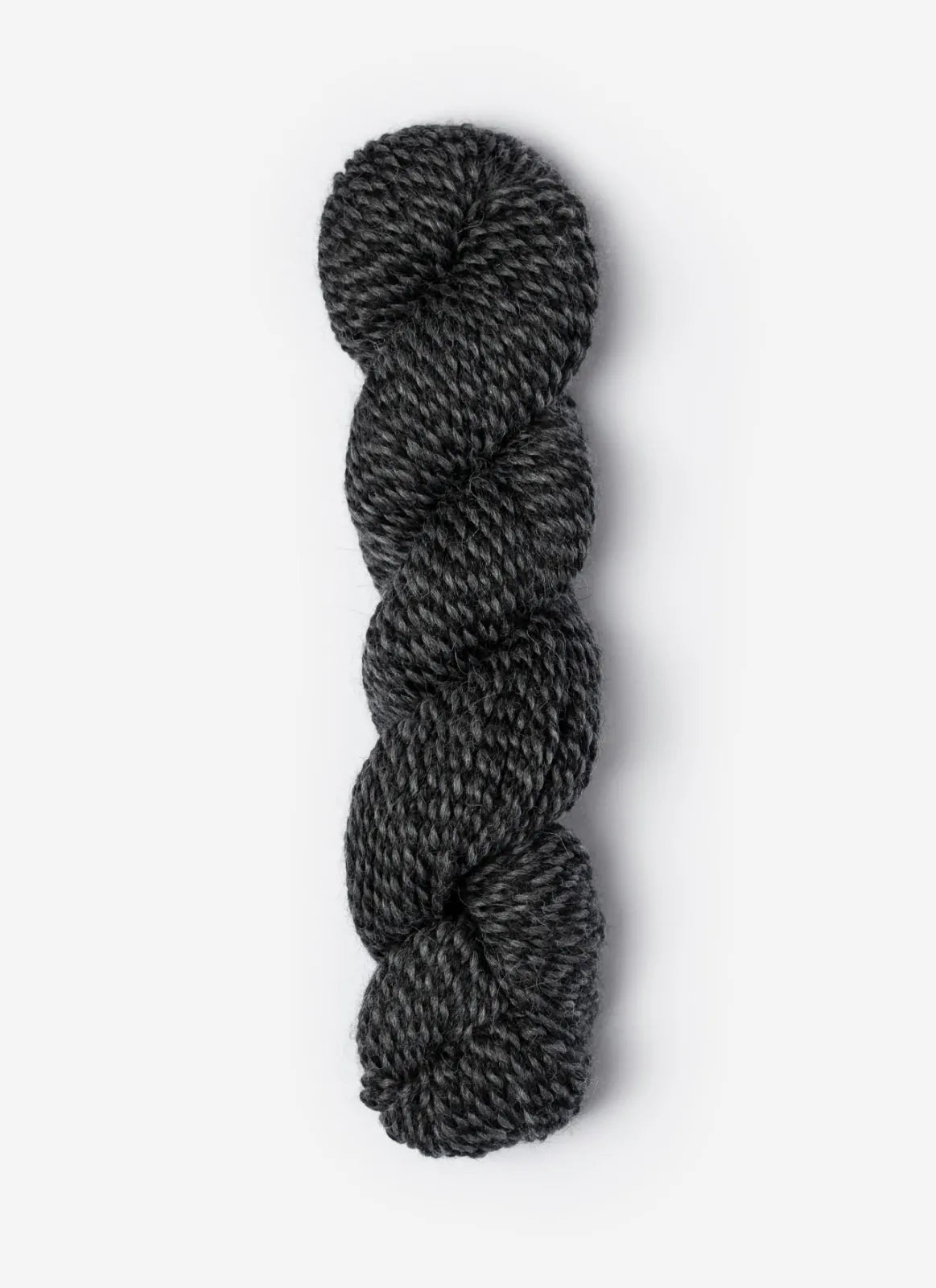 Blue Sky Fibers Baby Alpaca Sport Weight Melange alpaca yarn skein in soft blue and gray tones with label visible.