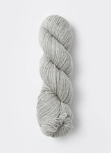 Blue Sky Fibers Sweater Worsted Superwash knitting yarn in blue, showcasing its soft wool and cotton blend for cozy projects.
