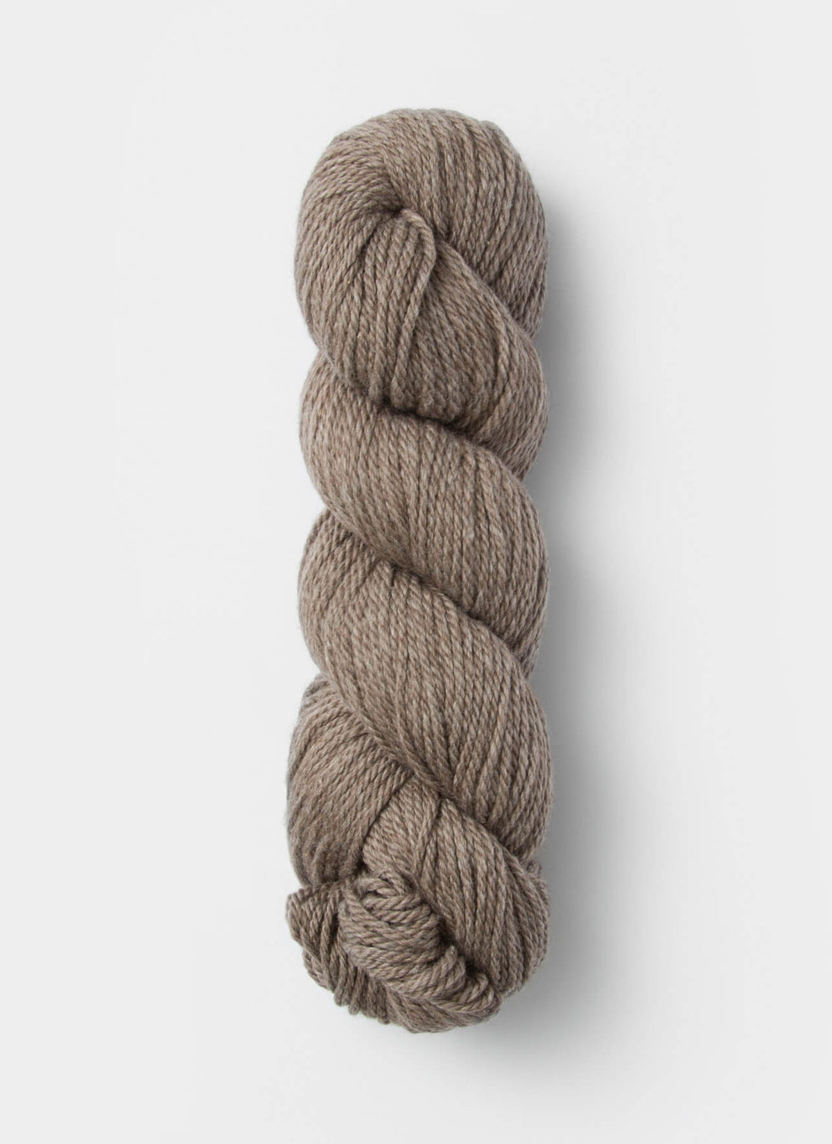 Blue Sky Fibers Sweater Worsted Superwash knitting yarn in blue, showing the soft, smooth wool and cotton blend fibers.