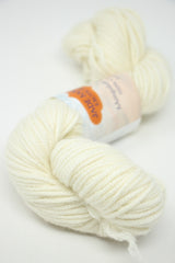 Cream-colored Jade Sapphire 8 Ply Cashmere yarn, soft and luxurious, shown in a close-up image highlighting its fine cashmere fibers.