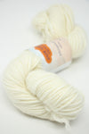 Cream-colored Jade Sapphire 8 Ply Cashmere yarn, soft and luxurious, shown in a close-up image highlighting its fine cashmere fibers.