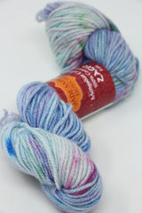 Cream-colored Jade Sapphire Zageo 6 Ply Cashmere yarn with floral pattern on white base, soft and luxurious textile.