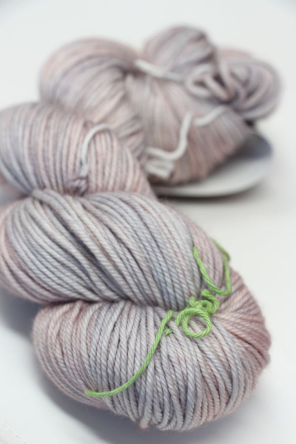 MadelineTosh Vintage Merino Wool Yarn in Calligraphy color, showcasing soft, hand-dyed yarn with rich, variegated tones.