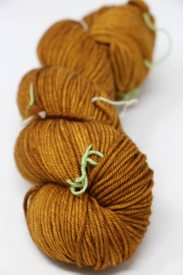 MadelineTosh Vintage Merino Wool Yarn in Glazed Pecan color, soft and textured for knitting or crochet projects.