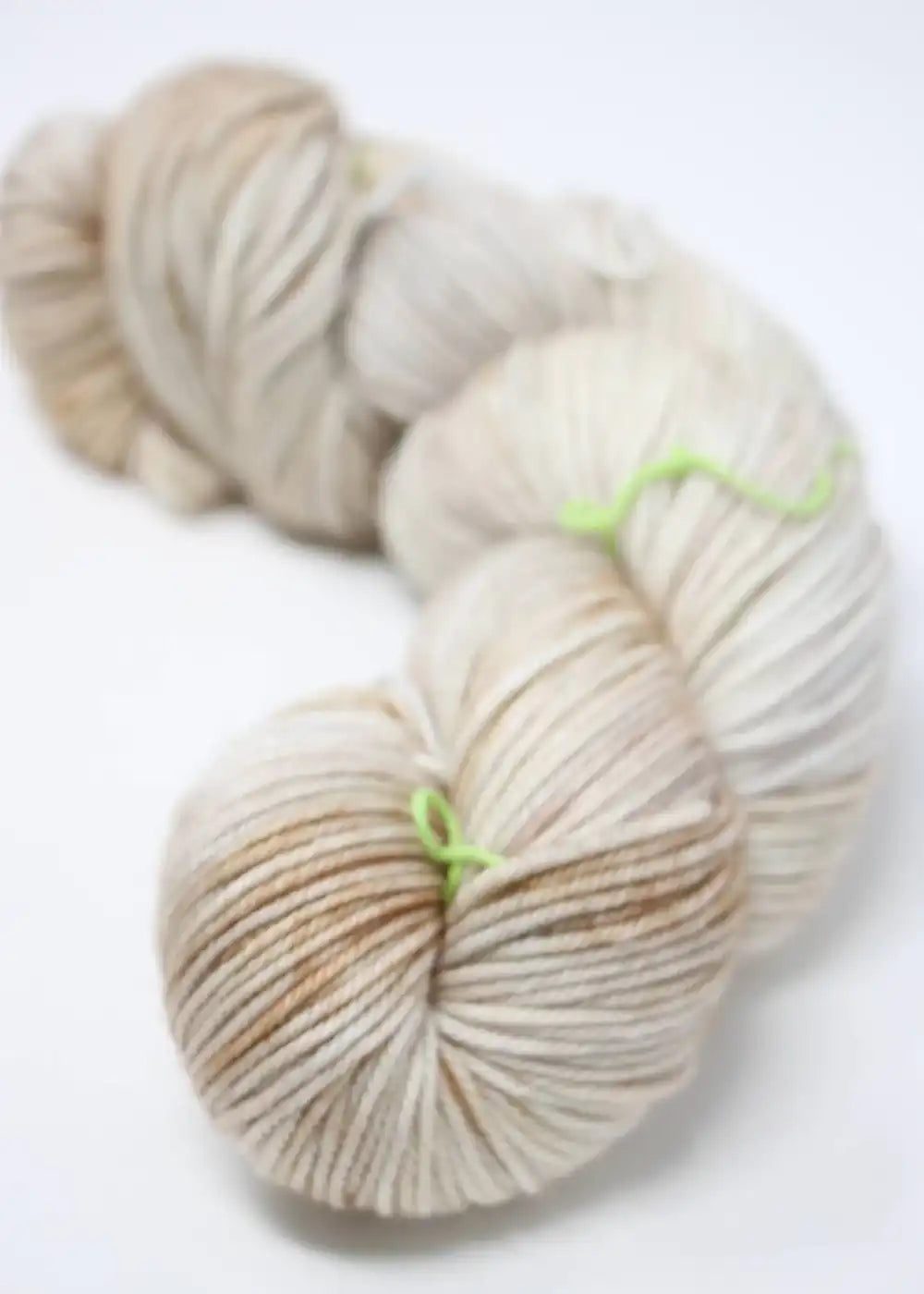Madeline Tosh Vintage Merino Wool Yarn in natural color, showcasing soft, textured fibers ideal for knitting or crochet projects.