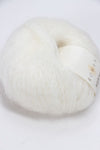 Cream-colored Rowan Kidsilk Haze yarn ball, soft and lightweight, suitable for knitting and crochet projects.