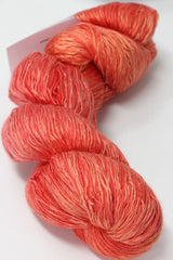 Colorful skein of Artyarns Ensemble Light yarn in Cosmic Colors, showcasing vibrant, soft-textured knitting yarn.