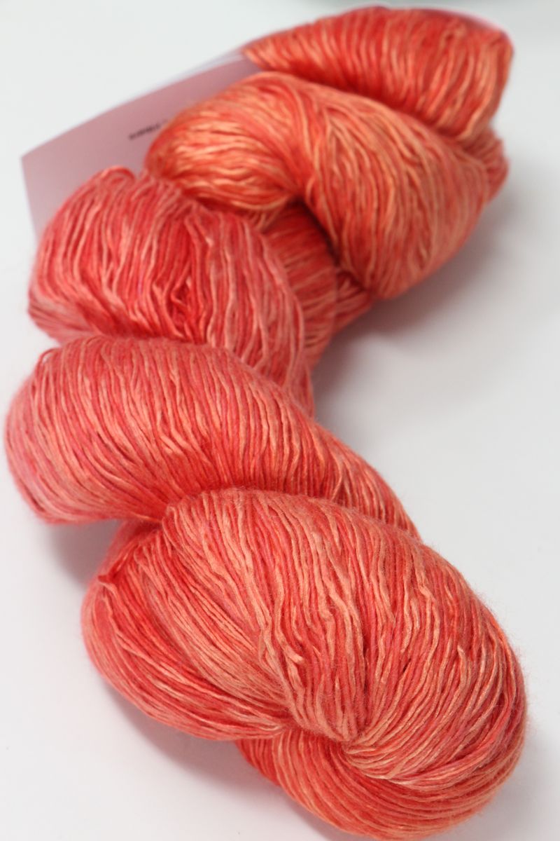 Colorful skein of Artyarns Ensemble Light yarn in Cosmic Colors, showcasing vibrant, soft-textured knitting yarn.