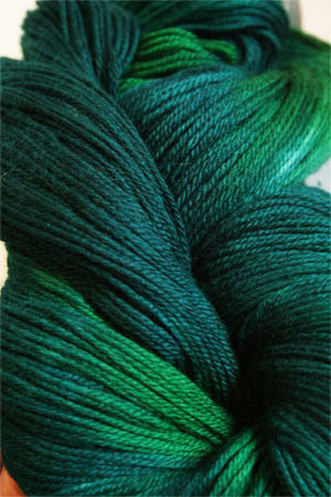Close-up of Artyarns Merino Cloud Yarn in soft, fluffy fibers showcasing its luxurious texture and subtle color variations.