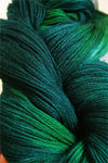 Close-up of Artyarns Merino Cloud yarn in soft, plush fibers showcasing its luxurious texture and gentle color variations.
