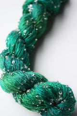 Beaded silk and sequins yarn from Artyarns' Beaded Silk & Sequins Light (H Series) with shimmering beads and delicate sequins.