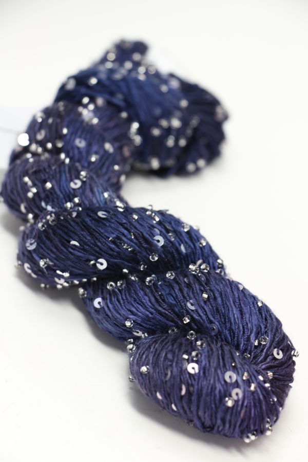 Beaded silk and sequins yarn by Artyarns from the Beaded Silk & Sequins Light series, showcasing a sparkly, textured fiber in a close-up view.