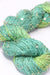 Beaded silk and sequin yarn by Artyarns from the Beaded Silk & Sequins Light H Series, showcasing shiny beads and delicate fibers.
