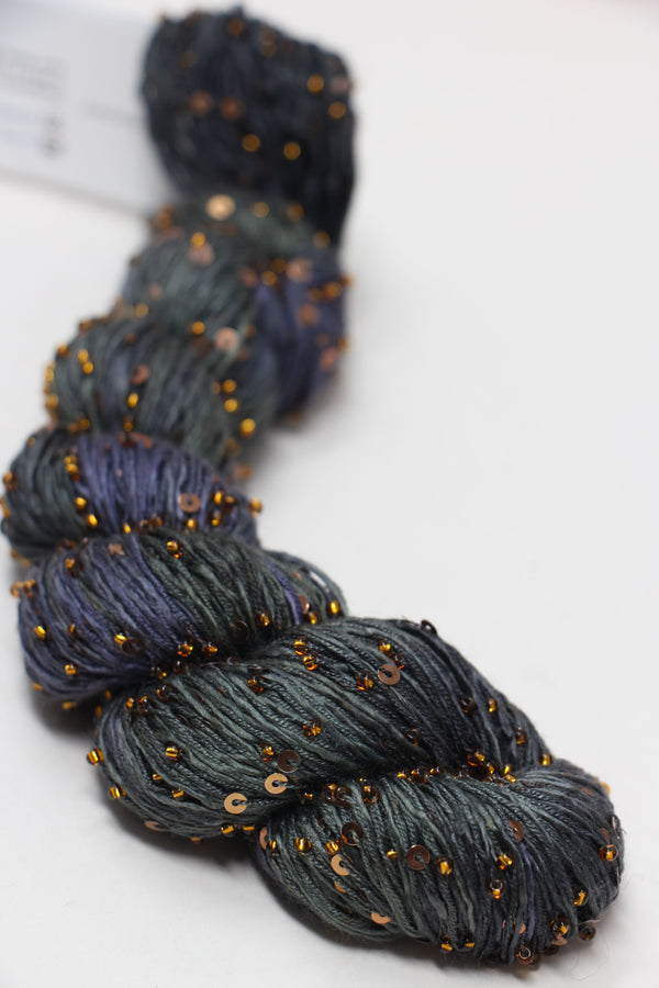 Beaded silk yarn with sequins from Artyarns' Beaded Silk & Sequins Light (H Series), showcasing shimmering beads and luxurious texture.