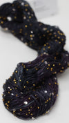 Beaded silk and sequins yarn by Artyarns, showcasing shimmering beads and delicate silk fibers in a vibrant color.