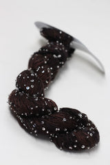 Beaded silk and sequins yarn by Artyarns with shimmering beads and sequins, showcasing the luxurious light H Series fiber.