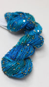 Beaded silk and sequins yarn by Artyarns, light H Series in a shimmering beaded yarn with sequins and silk strands.