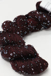 Beaded silk and sequins yarn from Artyarns' Beaded Silk & Sequins Light H Series, featuring shiny beads and delicate silk fibers.