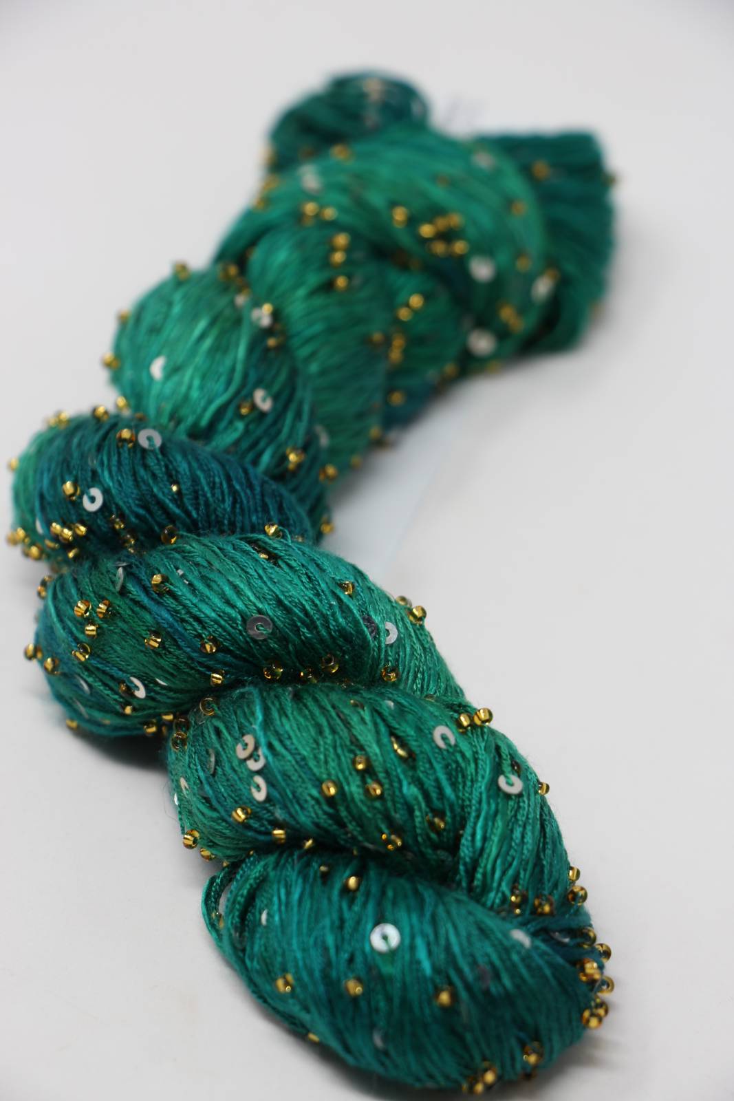 Beaded silk and sequins yarn by Artyarns, Light (H Series), featuring shimmering beads and sequins for elegant knitting or crochet projects.