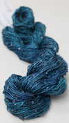 Beaded silk and sequin yarn from Artyarns' Beaded Silk & Sequins Light series, showing shimmering beads and delicate silk strands.