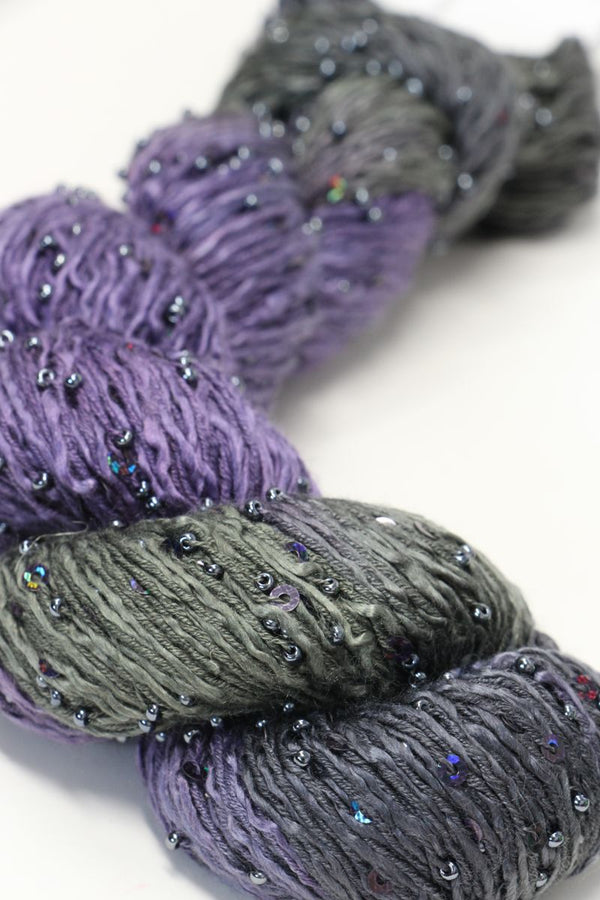 Beaded silk and sequins yarn from Artyarns' Beaded Silk & Sequins Light series, showing shimmering beads and intricate texture.