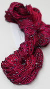 Beaded silk and sequins yarn from Artyarns' Beaded Silk & Sequins Light H Series, showing shimmering beads and fine silk strands.