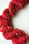 Beaded silk and sequins yarn from Artyarns' Beaded Silk & Sequins Light H Series, featuring shiny beads and sequins on soft yarn.