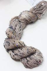 Beaded silk and sequins yarn from Artyarns' Beaded Silk & Sequins Light H Series, showcasing shimmering beads and delicate silk fibers.