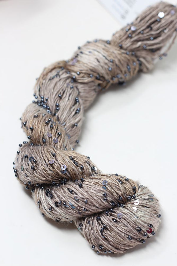 Beaded silk and sequins yarn from Artyarns' Beaded Silk & Sequins Light H Series, showcasing shimmering beads and delicate silk fibers.