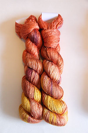 Close-up of Artyarns Regal Silk Yarn in 500 Painters color, showcasing smooth silk fibers and vibrant color details.