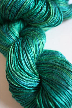 Close-up of Artyarns Silk Essence Lace silk yarn in soft, shiny strands, showcasing the luxurious texture and delicate lace finish.
