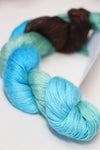 Fine Artyarns Silk Essence Lace silk yarn in a delicate lace pattern, showcasing soft, shiny silk fibers for knitting or crochet projects.