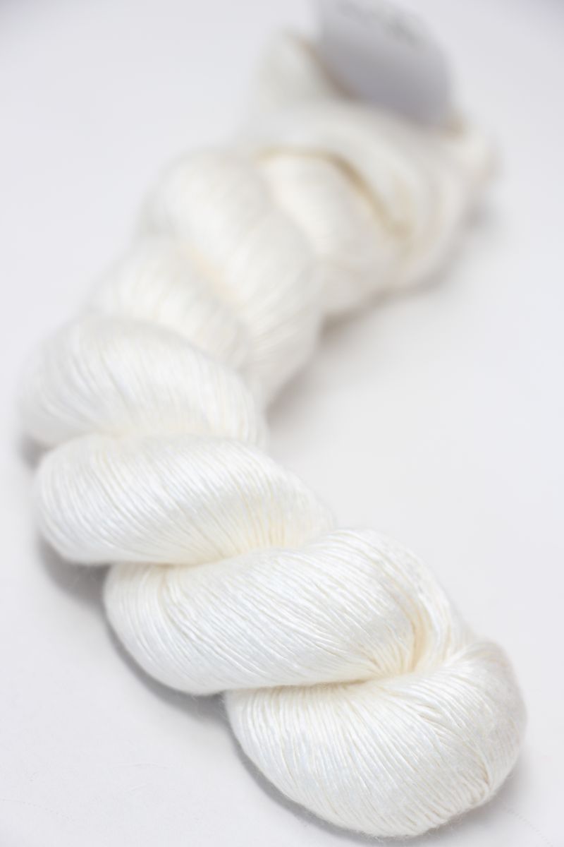 Close-up of Artyarns Silk Essence Lace silk yarn in a soft, shiny texture, showcasing its delicate and luxurious fiber quality.